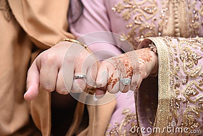 Close up of moroccon couple's hands at a wedding, concept of marriage, Stock Photo