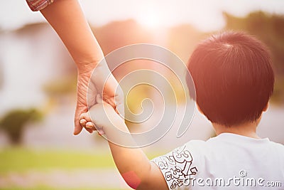 Close up mother holding a child`s hand. Stock Photo