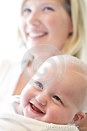 Close-up of mother holding seven month old baby Stock Photo