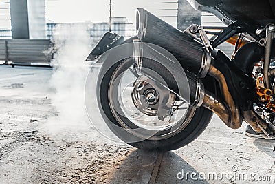 Close up of motorcycle wheel burnout at parking. Stock Photo