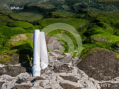 Close-up of mouth of sewer at day. Stock Photo