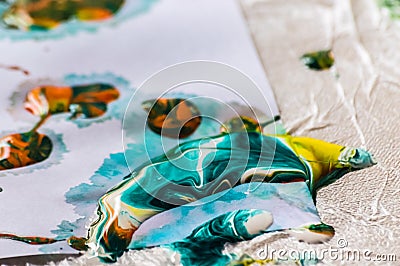 Close-up of multicolor acrylic paints on white paper Stock Photo