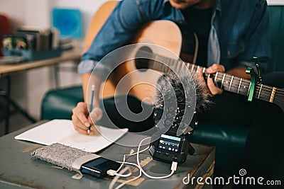 Close up of music recorder for creative musicians. Artist composer in work process, songwriter thinking and writing notes, man Stock Photo