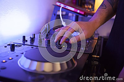 Close up of a music technician mixing tracks on his studio Stock Photo