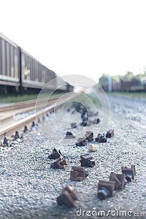 Close Up Narrow shot of a railway metal locks on the ground close to a freight train in a italian train depot in Bologna Stock Photo