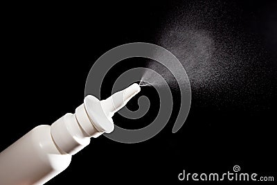Close-up of nasal drug spraying on black Stock Photo