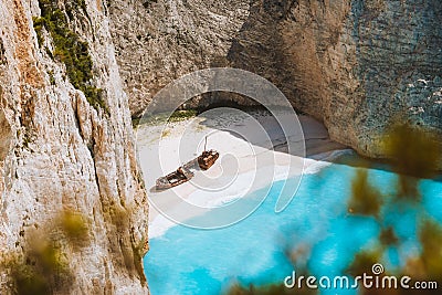 Close up of Navagio beach called Shipwreck bay. Turquoise water and pebble white beach and limestone walls. Famous Stock Photo