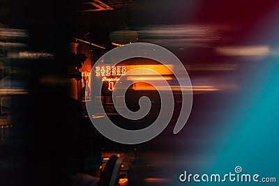 Close up of neon open sign barber blur bokeh abstract space for text ad advert items dark urban blue shop Editorial Stock Photo