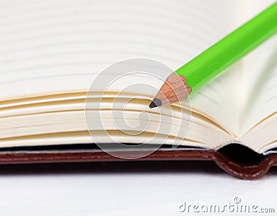 Close up of a new sharpen pencil on clean notepad Stock Photo