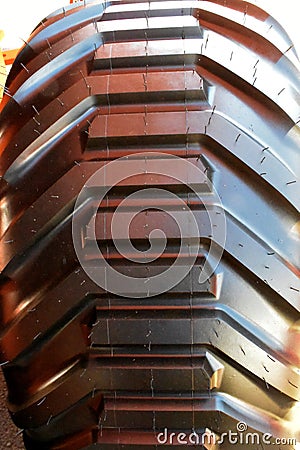 Close up new tractor wheel. Large unused truck tire Stock Photo