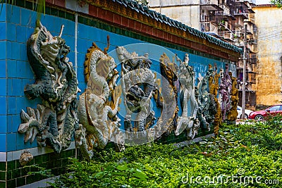 Close-up of Nine Dragon Wall in a Chinese garden Editorial Stock Photo