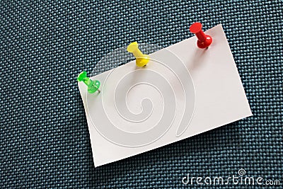 Close-up note paper and many colors pushpin into blue corkboard Stock Photo