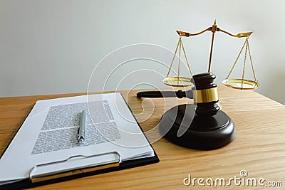 Close up object law concept. Judge gavel with justice lawyers and documents working on table Stock Photo