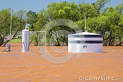 Close-up of oil tank under water as a result of midwestern storms and flash flooding Editorial Stock Photo