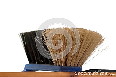 Close up old brush on the wooden floor on a white background Stock Photo
