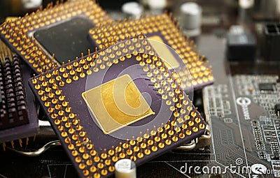 Close up old cpu microprocessor obsolete computer With gold as ingredient and motherboards. E-waste is a problem with Stock Photo