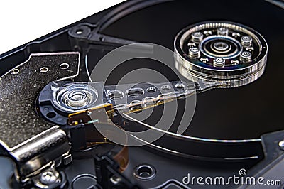 Closeup of an old fashioned, open, mechanical harddisc drive, isolated on a white background Stock Photo