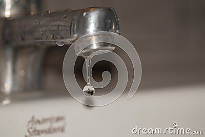 Close up old faucet with water drop background. Editorial Stock Photo