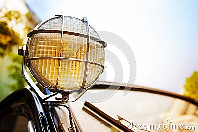 Close up of old head light on rarity black car Stock Photo