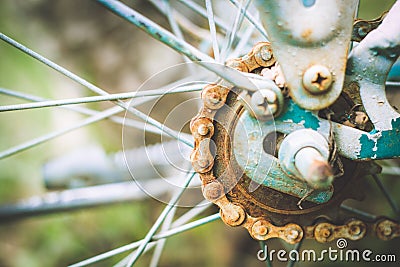 Close up of old rusty chain from the bicycle on background nature ,Bicycle`s detail view of wheel with old chain, sprocket,dirty Stock Photo