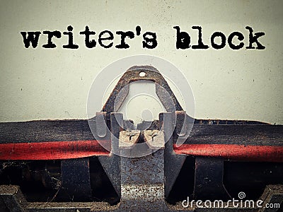 Close up of old typewriter covered with dust with writer`s block text. Stock Photo