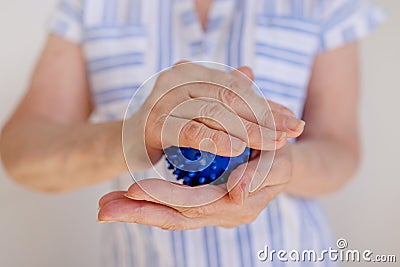 Self-massage technique with a prickly ball for hand diseases, arthritis Stock Photo