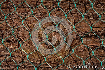 Close up of old wood fence panel with plastic diamond pattern n Stock Photo