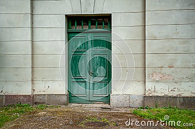 Green door in stone palace wall Stock Photo