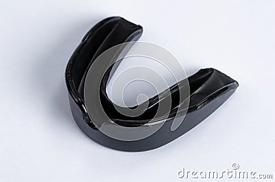 A black gumshield on a white background Stock Photo