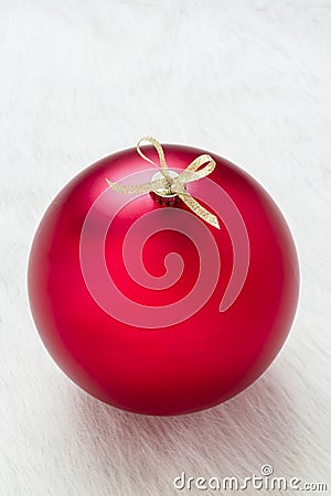 Close up of one simple perfect big red Christmas ornament decoration on white background vertical and empty blank copy space Stock Photo