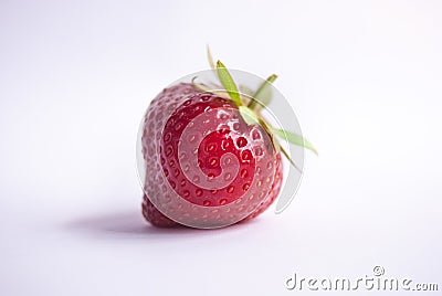 Single strawberry with petiole and leaves Stock Photo