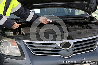 Close - Motor repair. Locksmith in a working jacket Stock Photo