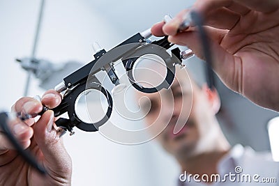 Close-up of optometrist holding messbrille Stock Photo