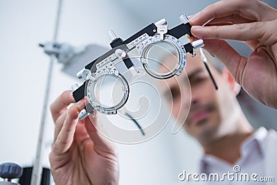 Close-up of optometrist holding messbrille Stock Photo