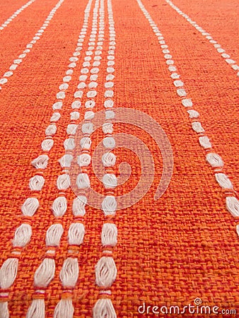 Close up of orange fabric patterns with white lines Stock Photo