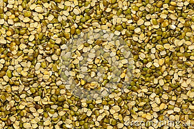 Close up of Organic green Gram Vigna radiata or spilt green moong dal un polished spilled and in a glass jar. Stock Photo