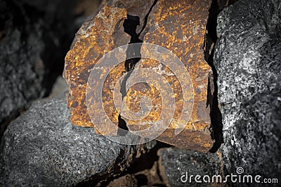 Close up outdoor view of stone on the ground. Piece of orange rocky stone. Beautiful texture Stock Photo