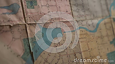 Close-up of outline map details. Stock footage. Details of marked area on contour map. Old contour map with markers and Stock Photo