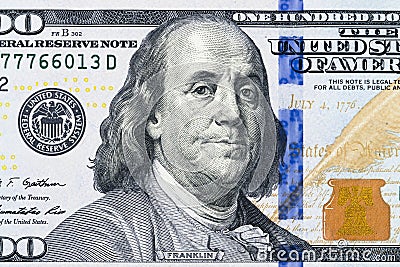 Close up overhead view of Benjamin Franklin face on 100 US dollar bill. US one hundred dollar bill closeup. Heap of one hundred Stock Photo