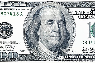 Close up overhead view of Benjamin Franklin face on 100 US dollar bill. US one hundred dollar bill closeup. Heap of one hundred Stock Photo