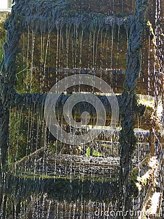 Close up of a paddle wheel in operation on the Sorgue river at Fontaine de Vaucluse in Provence Stock Photo