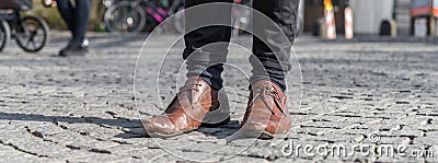 Close up of a pair of worn out shoes with relieved shoe sole Stock Photo