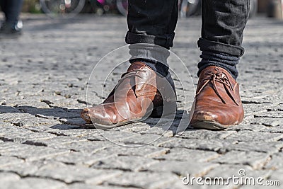 Close up of a pair of worn out shoes with relieved shoe sole Stock Photo