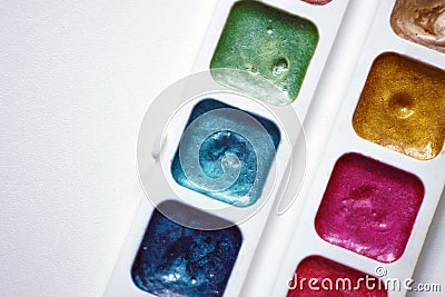 Close-up of a palette of glittering paints Stock Photo
