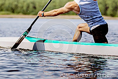 close-up part body male canoeist on canoe single rowing training on lake Stock Photo