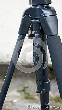 Close up part of camera tripod outdoors Stock Photo