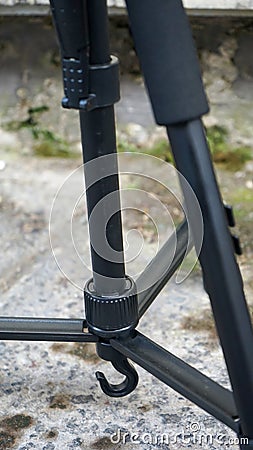 Close up part of camera tripod outdoors Stock Photo