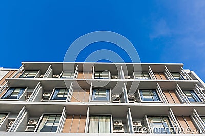 Close up part of condominium modern style on blue sky background Stock Photo