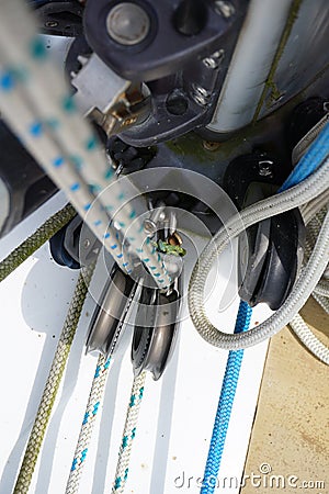 Close up of part of sailboat rigging with rope and metal parts. Stock Photo