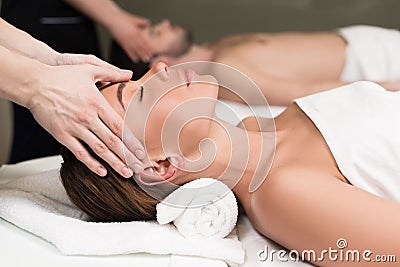 close-up partial view of young couple having massage in spa Stock Photo